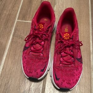 Nike pink, orange, and white. SuperRip flyknit go 3 training shoe.